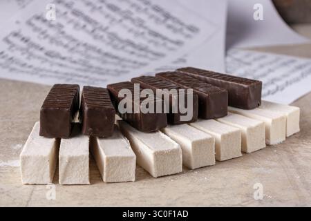 Piano keyboard made of white and chocolate marshmallow, selective focus Stock Photo