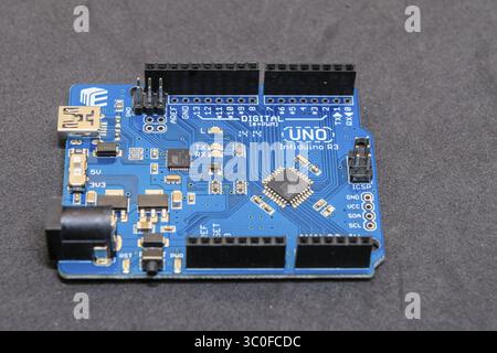 An Arduino board with digital components, showcasing a blue circuit board design Stock Photo