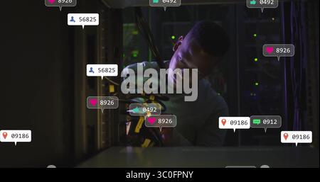 In school, image technician working on server cables with notifications overlay Stock Photo