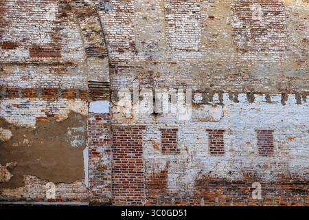 Layers of decay on this old bruild building exterior wall can be used as a backdorp Stock Photo