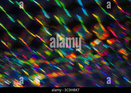 Holographic background with multiple colors. Colorful bokeh on defocused background. Neon lines. Stock Photo