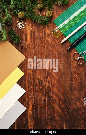 Workspace for paper crafts. Green cutting mat, colored paper, pencils, scissors, ruler. Space for your text. Stock Photo