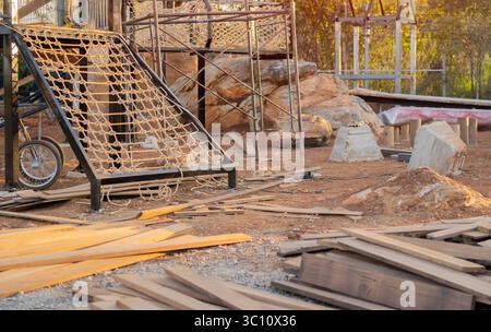 Playground in the park under construction. Children's wooden playground concept. The construction site concept. Stock Photo