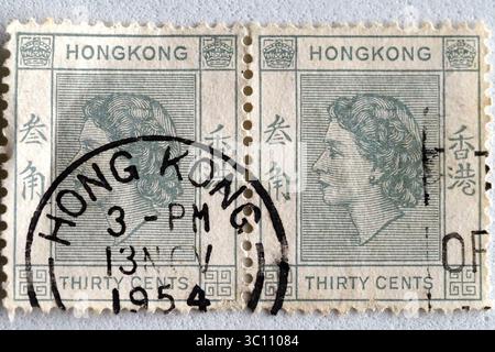 Macro view of the Chinese stamp dedicated to Queen Elizabeth II "Elizabeth Alexandra Mary" Queen of the United Kingdom of Great Britain. Stock Photo