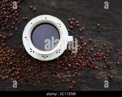 Coffee. Cup Of Coffee with Beans on a Wooden Background. Border Design Stock Photo