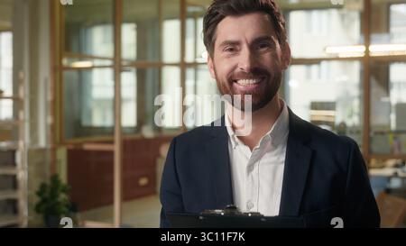 Business man thoughtful guy reading documents in office deal contract sign businessman Caucasian male professional analyzing data graphs data papers Stock Photo