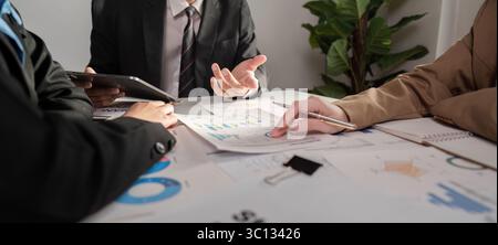 Professional Business Team Collaborating on Strategic Work Plans in a Modern Office Environment Stock Photo