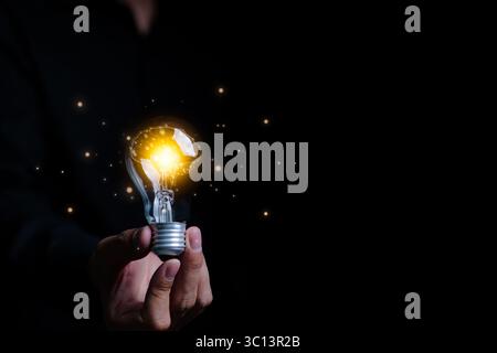 Businessman an holding illuminated light bulb with brain inside. New idea innovation concept, Business Bright idea concept, Creative and innovation Stock Photo