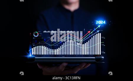 Corporate business figures and future growth arrow chart 2024 year. Analyst work in Business Analytics and Data Management System to make report Stock Photo