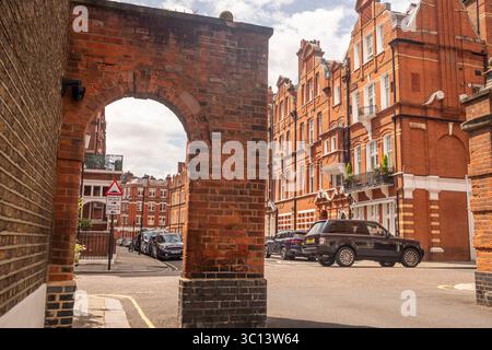 LONDON- JULY 15, 2025: Red brick mansion buildings in the prestigious neighbourhood around Egerton Gardens in South Kensington Knightsbridge area Stock Photo