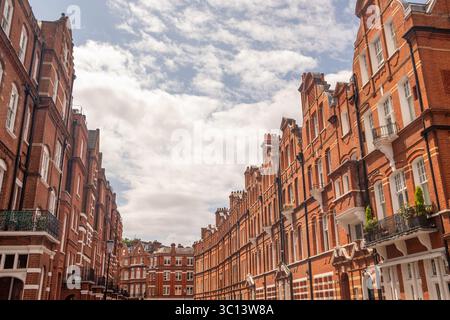 LONDON- JULY 15, 2025: Red brick mansion buildings in the prestigious neighbourhood around Egerton Gardens in South Kensington Knightsbridge area Stock Photo