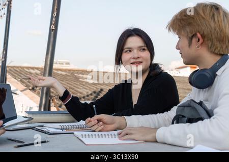 High School Students Collaborate on Homework and Projects in a Relaxed After-School Study Session Stock Photo