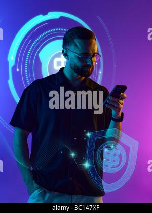 Man reading smartphone with glowing finance icons in neon gradient background Stock Photo
