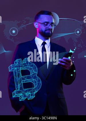 Businessman checking crypto app on the phone with bitcoin hologram in purple neon lightning Stock Photo