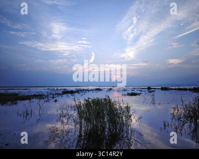 sunset over the lake with deep blue sky Stock Photo