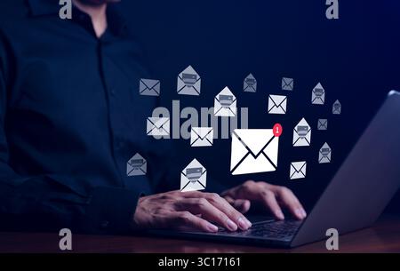 Businessman checking email and sending email on computer. New e-mail notification concept for business communication and digital marketing. Inbox, Stock Photo