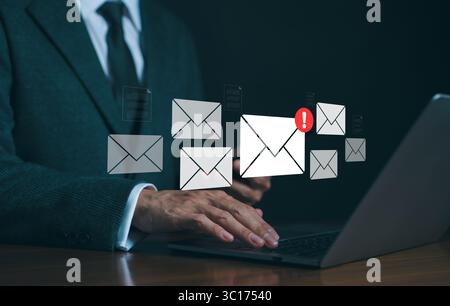 Spam mail and Phishing email, Cyber security concept. Businessman checking e-mail and sending on computer. Alert spam virus with warning caution, Junk Stock Photo
