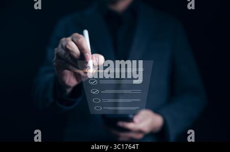 Online checklist concept. Businessman using smartphone doing online checklist survey. Filling out digital evaluate, list of questionnaire assessments, Stock Photo
