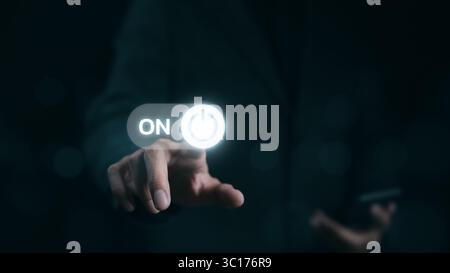A businessman is shown in the act of touching a virtual toggle switch button, which is used to turn a device on or off. Slider button hologram, Stock Photo