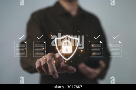 The concept of document safety and security protection system. Businessman using online documentation database management software technology. Manage Stock Photo