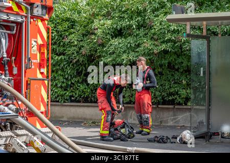 Gennevilliers, France - 07 14 2025: A group of Firefighters after having put out an emergency fire Stock Photo