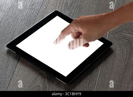 hand presses on screen digital tablet Stock Photo