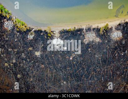 May 15, 2007 - Grand Marais, Minnesota, U.S. - Lake Homes along the north shore of Gunflint Lake were reduced to a pile of ash after the Ham Lake Fire ravaged the area late last week. Some residents will be allowed back into the area to inspect their property. The Ham Lake Fire, which started from at a campsite at Ham Lake on the Upper Gunflint Trail, has destroyed 134 structures since it was first spotted May 5, 2006. Loss is estimated at .7 million. More than 270 people have been evacuated from their homes and businesses. (Credit Image: Brian Peterson/Minneapolis Star Tribune/TNS via ZUMA Wi Stock Photo