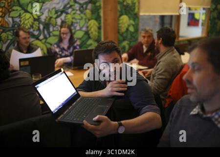 January 30, 2018 - Minneapolis, MN, U.S.A - Kellen O’Brien and Ahti Hujanen, right, discussed the water system project during the Engineers Without Borders meeting at Brew 612. ....The Minnesota chapter of Engineers Without Borders, a group of highly educated men and women who use their free time designing and building systems to help communities in developing nations, is now helping a small mountain village in Honduras build a new water treatment system that cleans and stores water. They met at 612 Brew Wednesday night, January 31, 2018, to go over plans for work that will be done on the next Stock Photo