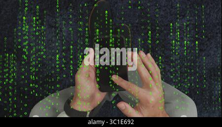 Man wearing shirt and jeans holding smartphone on dark blue carpet, with smartwatch and binary code Stock Photo