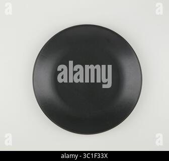 Matte black ceramic cup bottom isolated nature background with clipping path Stock Photo