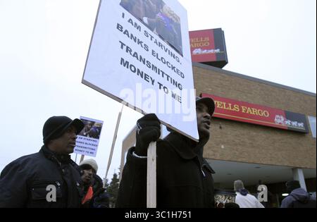 Jan. 13, 2012 - Minneapolis, MN, U.S. - Mouk Tar along with Somalis and supporters protested outside of the Wells Fargo branch on the 3000 block of Nicollet Ave in Minneapolis Min., Friday, January 13, 2012.Some of the Somali community members present at the rally closed their bank accounts as a part of protesting Wells Fargo not work ing with Hawalas so the community can transfer money home... (/STAR TRIBUNE) (Credit Image: Kyndell Harkness/Minneapolis Star Tribune/TNS via ZUMA Wire) Stock Photo