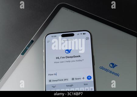 New York, USA - July 18, 2025: Typing new promt how to in DeepSeek app on tablet screen close up view Stock Photo