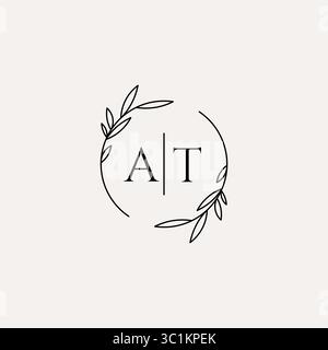 Letter AT wedding monogram logo design with simple natural circle leaf frame vector graphic Stock Vector