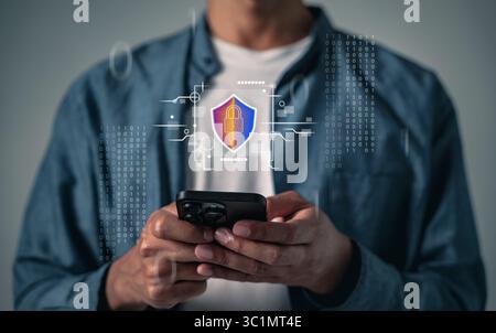 Protect your password and bank details with mobile cybersecurity, the phone displays a digital shield and secure login, ensuring online systems are pr Stock Photo