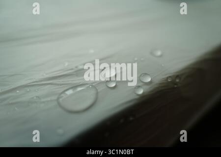 Close-up view of water droplets on a smooth surface Stock Photo