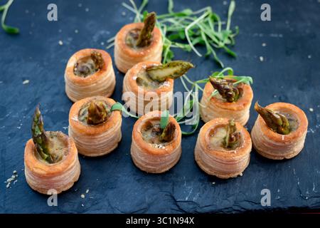 Mini Asparagus Vol-au-Vent Puff Pastry Appetizers on Slate Stock Photo