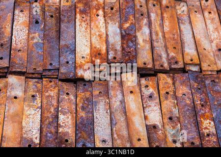 Texture of rusty plates stacked in a stack close up. Side view. Stock Photo