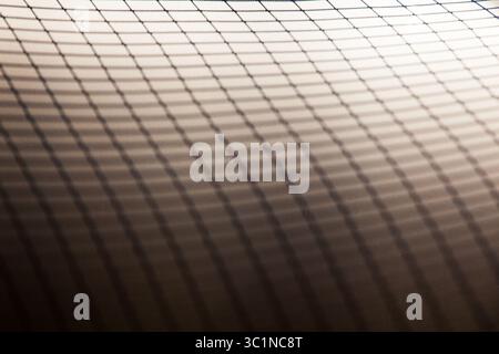 Grid reflection on a white and gray background. Stock Photo
