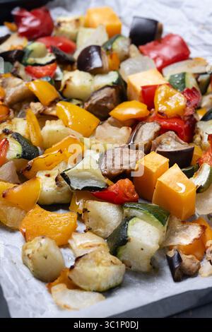 Roasted vegetables on a baking tray isolated on white background Stock Photo