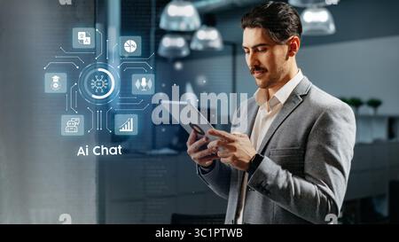 Professional man engaging with AI chat technology in an office setting during work hours Stock Photo