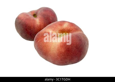 Flat peaches isolated against white background Stock Photo