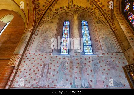 Interior of St. Mary's Church in Sigtuna parish in the Uppsala diocese, Uppland, Sweden. On the long wall at the end of the northern aisle, there is a Stock Photo