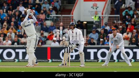 Wikets Vector England captain Harry Brook plays a sweep shot from one knee with his ...