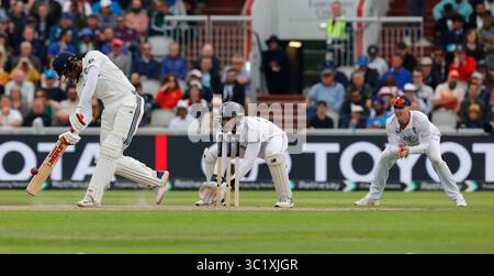 Wikets Vector England captain Harry Brook plays a sweep shot from one knee with his ...