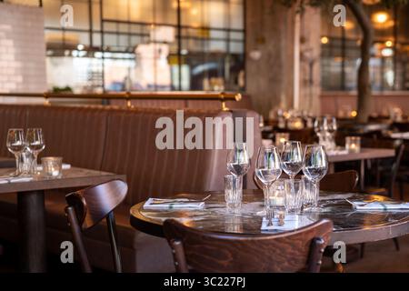 Elegant Restaurant Interior with Table Set for Dinner Stock Photo