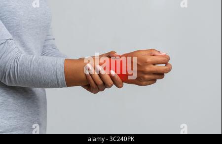 Cropped image of black woman suffering from rheumatism Stock Photo