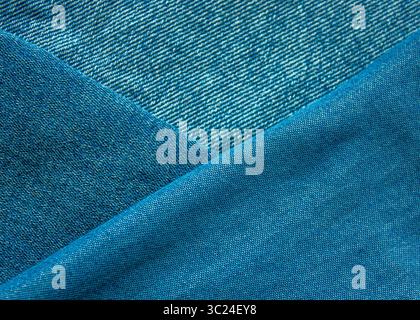 Background from fabric blue jeans of different shades and brightness. jeans texture. Jeans texture. Jeans background. Denim texture or denim jeans bac Stock Photo
