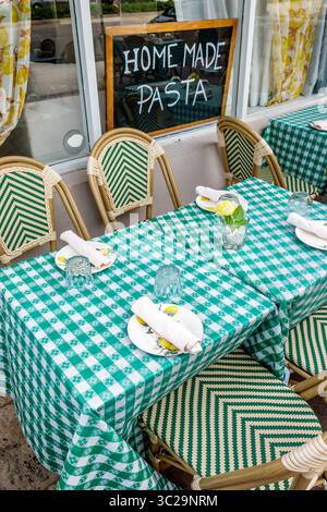 Miami Beach Florida,Washington Avenue,Limoncello Miami,restaurant restaurants dine dining eating out,outdoor seating sidewalk tables set for four,gree Stock Photo