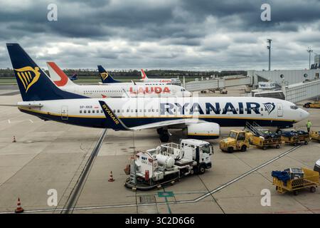 VIENNA, AUSTRIA - OCTOBER 05, 2024: Lauda aircrafts parked on the tarmac under an overcast sky at Vienna International Airport. Stock Photo