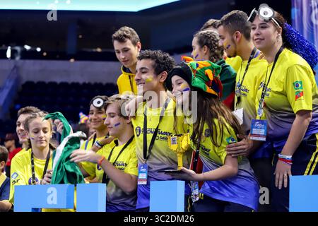 June 1, 2019: Montevideo, Uruguay: Champions from Brazil celebrate their team victory in the FIRST LEGO League Open 2019, at the Antel Arena. FIRST LEGO League (FLL) is an international competition organized for elementary and middle school students. Each year in August, FFL introduces a scientific and real-world challenge for teams to focus and research on. The robotics part of the competition involves designing and programming LEGO Mindstorms robots to complete tasks, and students work out solutions to the various problems they are given and then meet for regional tournaments to share their Stock Photo